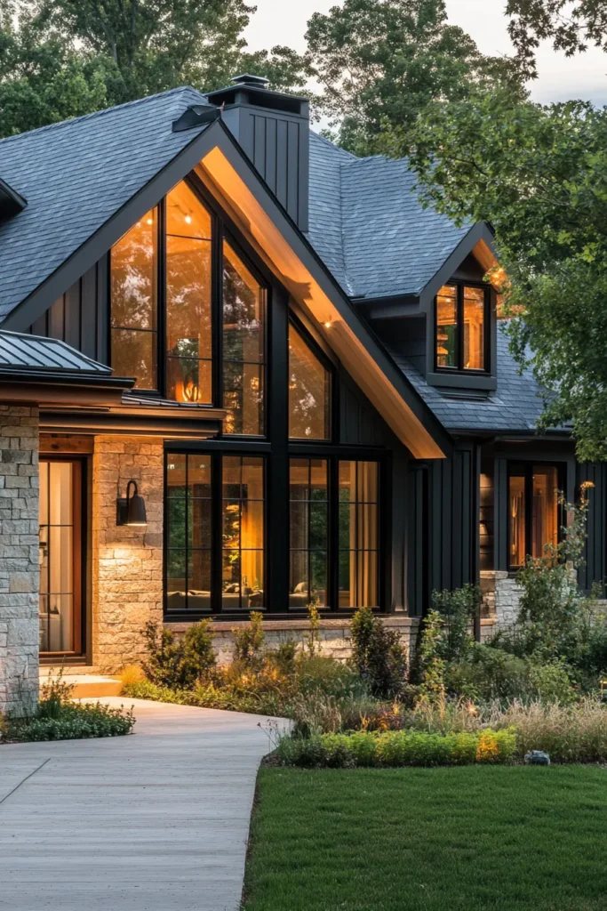 A warmly lit contemporary home nestled among mature trees